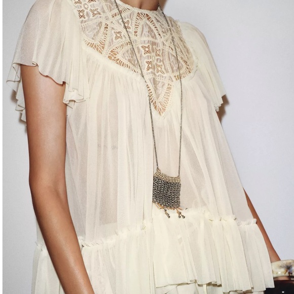 Zara Tops - EMBROIDERED FLOWY BLOUSE
Zara Cream Sheer Blouse with Lace Detail